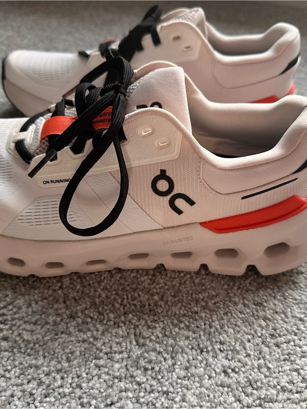 On Running Women’s Running Sneakers in Light Pink with Orange Accents